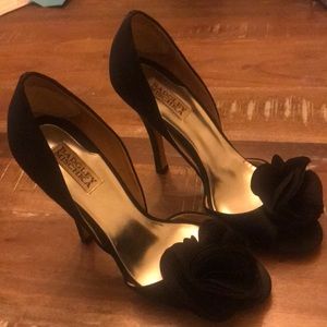 Badgley Mischka black satin pumps with detail.